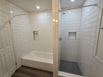 Upstairs Bathroom tub shower combo and stall shower